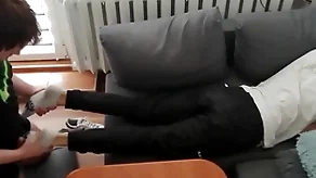 Young guy pays out his lolly with his paws